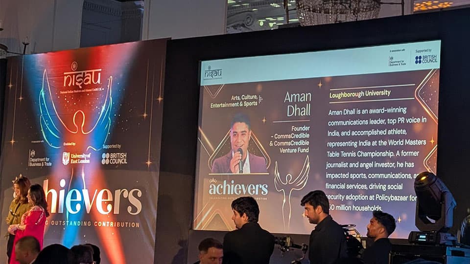 An image of Aman on screen at the NISAU India-UK High Achievers Award at the House of Lords, London.